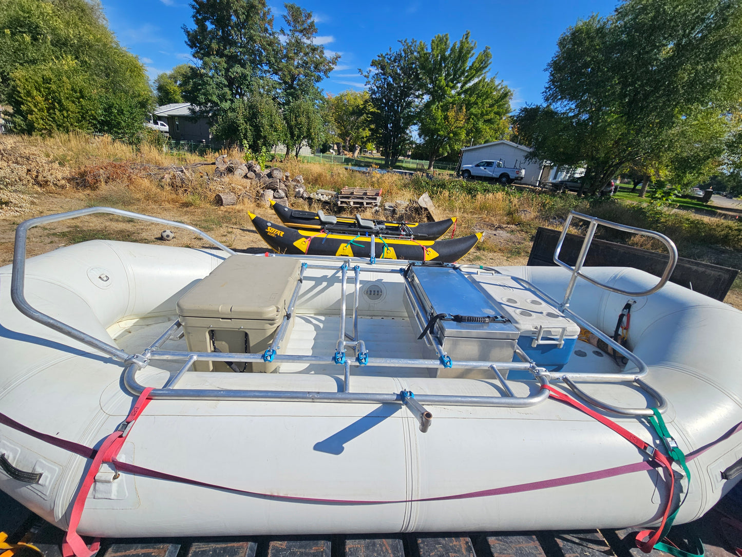 Class V Adventure Gear Aluminum fishing frame with 2 coolers and dry box on a white 14' raft.