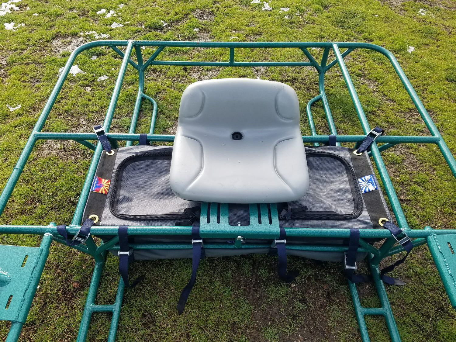 Class V Drop Bag positioned on cata-raft frame with secure seating and storage options.